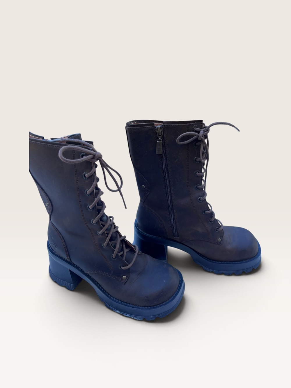 vintage 1990s/Y2K
Candie's platform boots feature a dark brown leather mid-calf